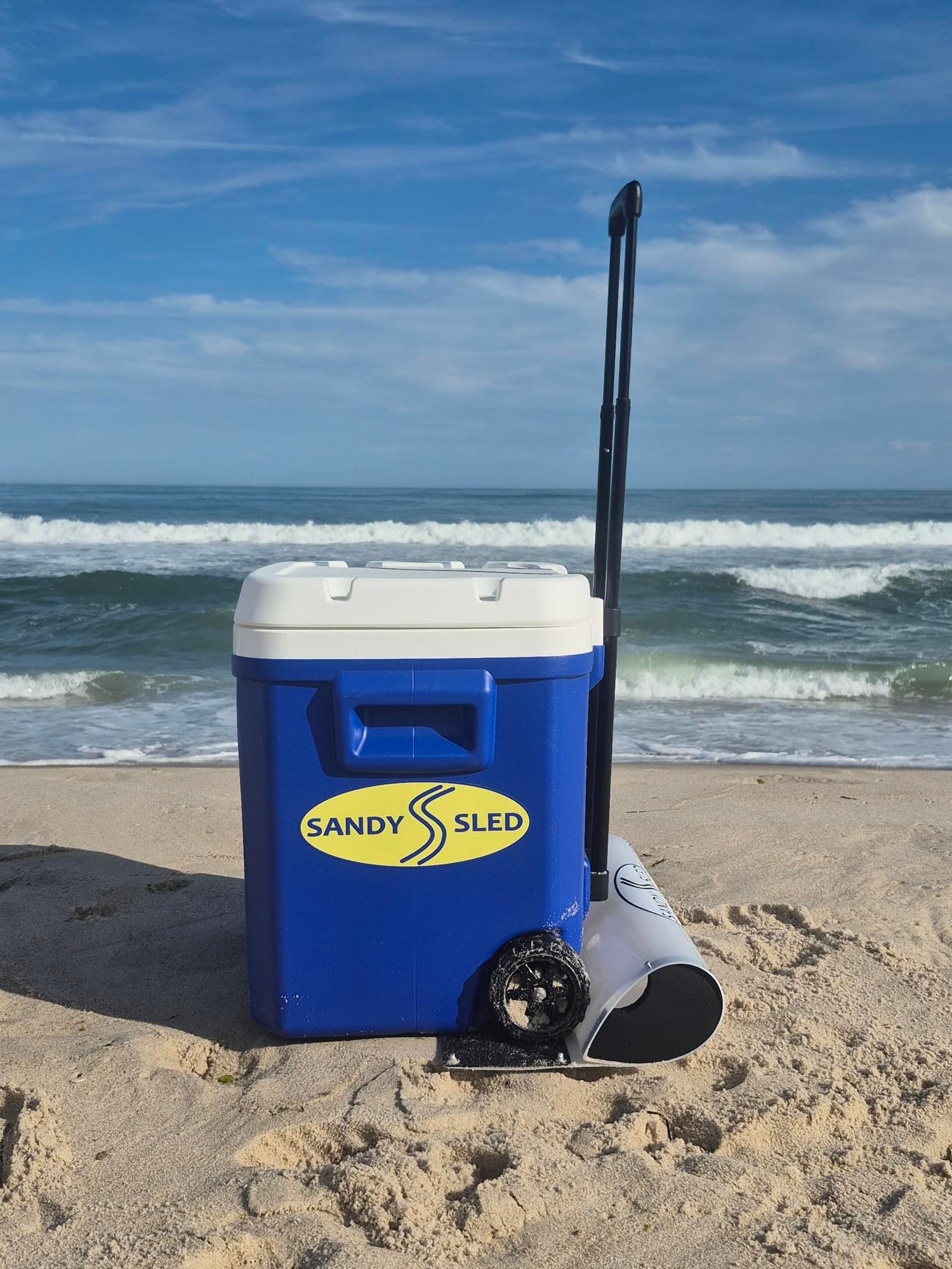 SandySled cooler setup on beach sand